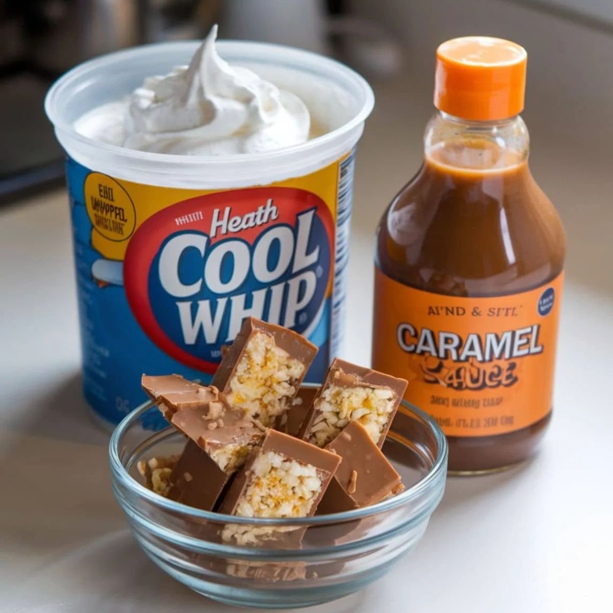 Better Than Sex Cake Recipe Toppings – A combination of Cool Whip whipped cream, caramel sauce, and chopped Heath toffee bars. The perfect sweet and creamy topping for a decadent chocolate dessert.