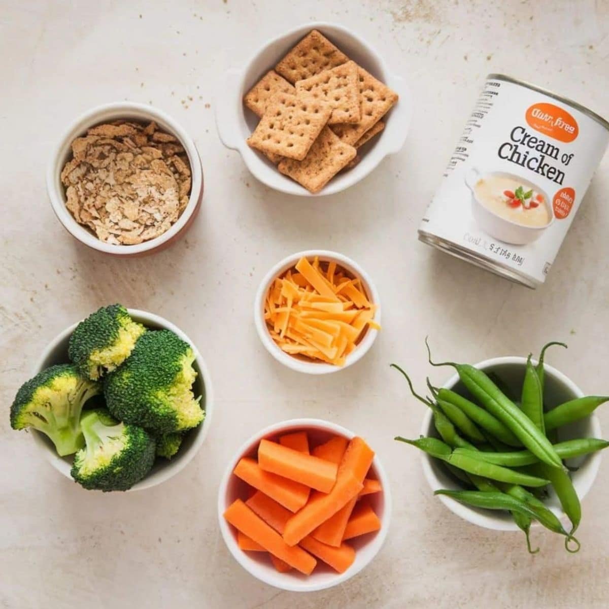 Fresh Ingredients for a Chicken Casserole Recipe – A wholesome selection of broccoli, carrots, green beans, cheddar cheese, whole wheat crackers, and cream of chicken soup. Perfect for a healthy and hearty baked casserole dish.