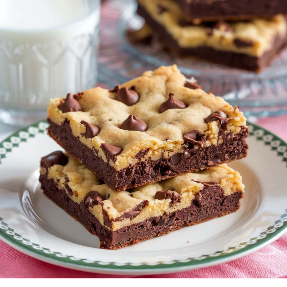 Two gooey and delicious brookies stacked on a plate, showcasing the perfect combination of brownie and cookie layers, ideal for a Brookie Recipe.