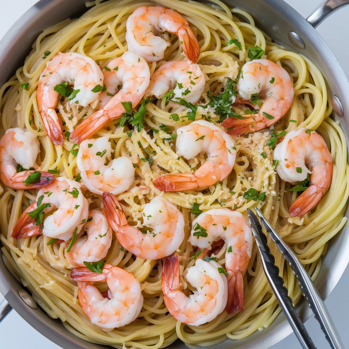 A savory pan of Garlic Butter Shrimp and Pasta, featuring succulent shrimp cooked in a rich garlic butter sauce, served over perfectly cooked spaghetti and garnished with fresh parsley and Parmesan. A delicious and easy seafood pasta dish bursting with flavor.