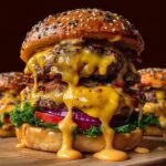Close-up of a juicy Crack Burgers with double beef patties, crispy bacon, melted cheese dripping down, lettuce, red onion, and a seeded brioche bun on a wooden board.