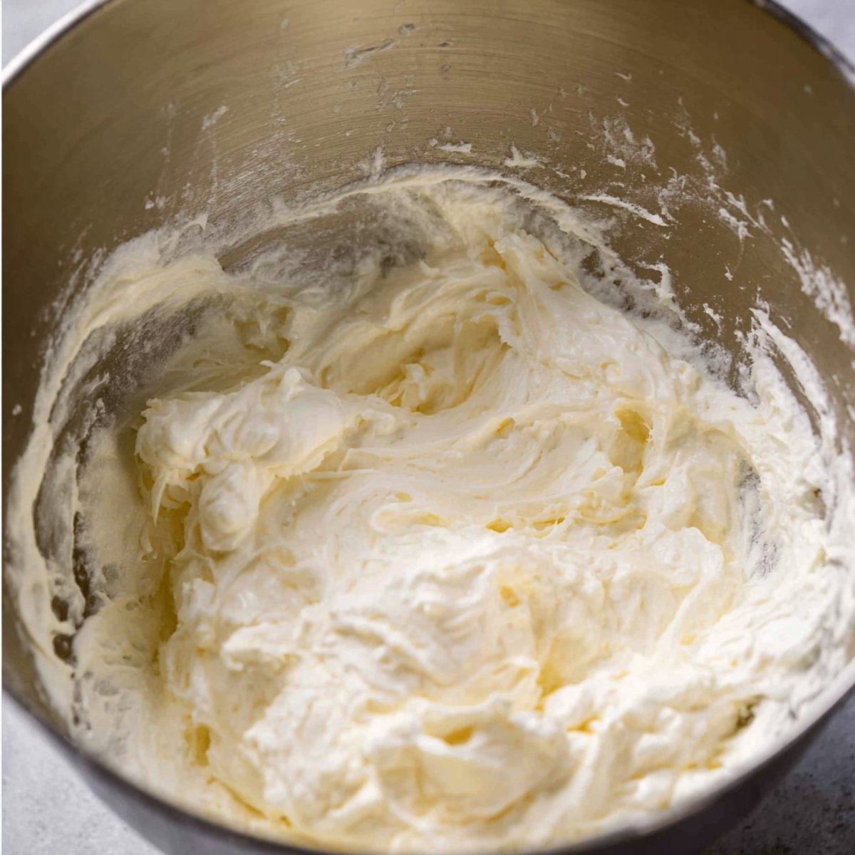 Add the whipping cream to a large bowl or stand mixer. Beat it with electric beaters for about a minute or two until it starts to thicken up.