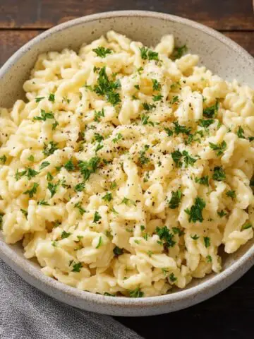 Homemade Spaetzle served in a bowl, showcasing the soft, tender texture of the dumplings.