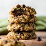 A stack of freshly baked Zucchini Chocolate Chip Cookies, showcasing their golden-brown edges and soft, chewy texture.